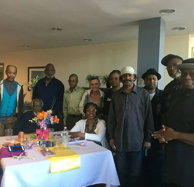 A group of people gathered around a table.