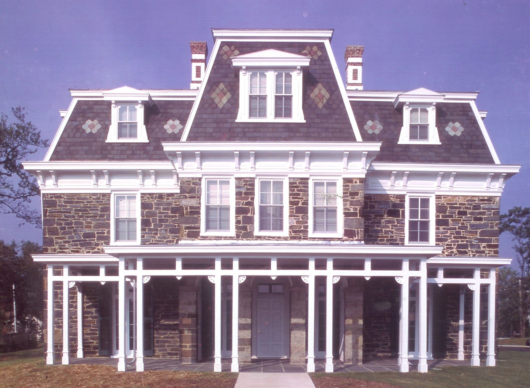 A large house with many windows and doors.